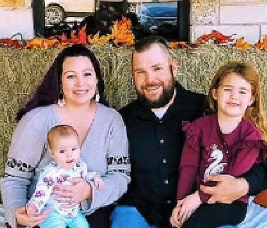 Picture of Mattea Goff with her husband and two young children