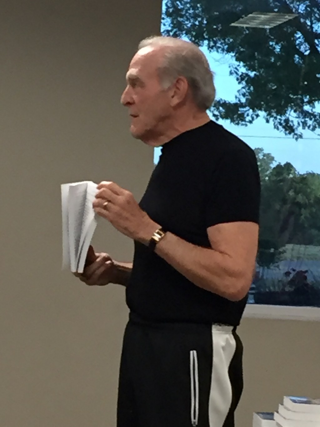 Picture of author Robert Workman speaking to a crowd